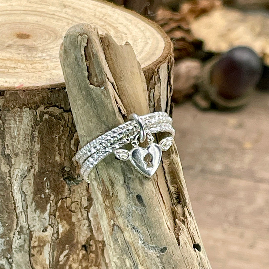 Bague femme SHUT UP & LOVE ME – argent 925 et pendentif cadenas cœur ailé, multi-anneaux facettés