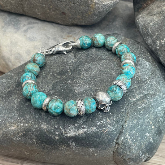 ESPERANZA BRACELET HOMME EN  PERLES  DE TURQUOISES SUD AFRICAINE ET INTERCALAIRE TÊTE DE MORT EN ARGENT 925