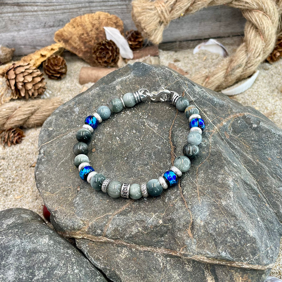 Bracelet homme OCEAN JUICE – perles d’œil d’aigle 8 mm, donut signature et fermoir mousqueton argent 925