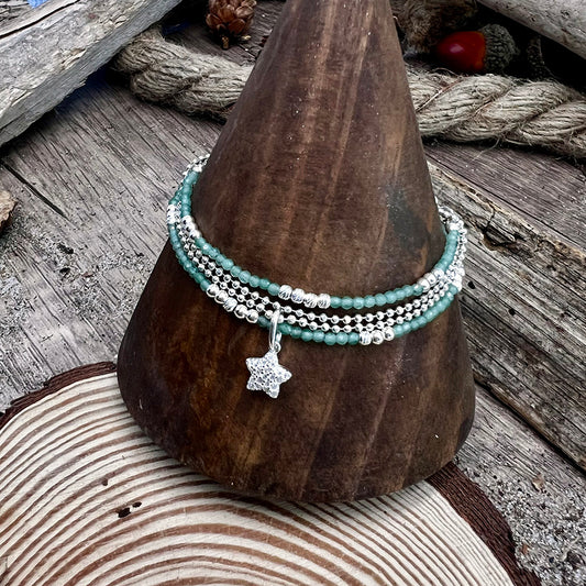 THE GUARDIAN MULTI-ROW BRACELET IN RUBY PEARLS AND GUARDIAN ANGEL PENDANT IN 925 SILVER
