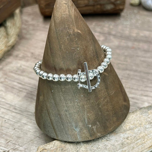 Bracelet femme D FOR DESIRE – perles boules 5 mm & fermoir toggle fer à cheval gravé et argent 925 – bijoux fait main en argent 925 | Pitch & Néo