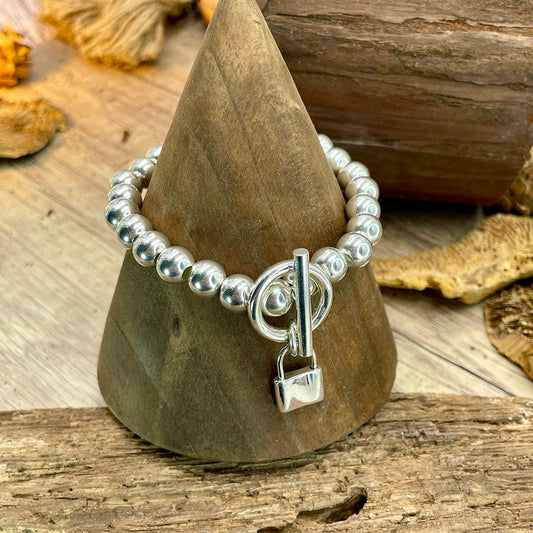 Bracelet femme LOCKED ICON – perles boules 8 mm argent 925, fermoir toggle & pendentif cadenas plein argent massif – bijoux fait main en argent 925 | Pitch & Néo