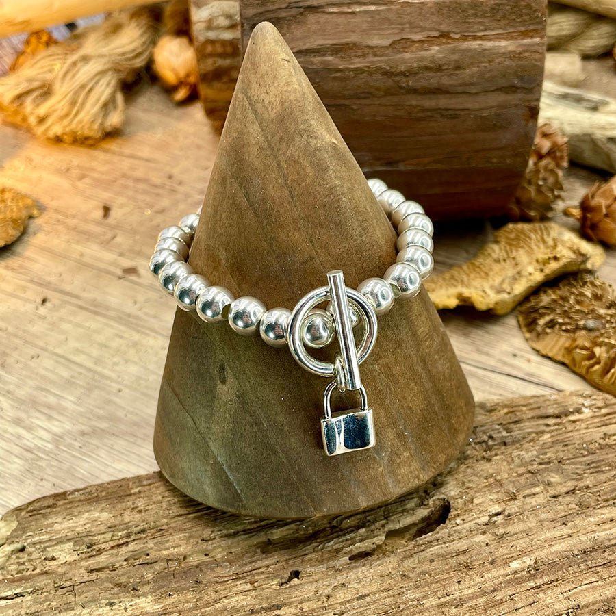 Bracelet femme LOCKED ICON – perles boules 8 mm argent 925, fermoir toggle & pendentif cadenas plein argent massif – bijoux fait main en argent 925 | Pitch & Néo