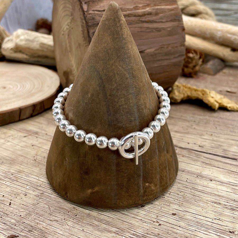 Bracelet femme TOGGLE ICON – perles en argent 925 et fermoir toggle central sur élastique – bijoux fait main en argent 925 | Pitch & Néo