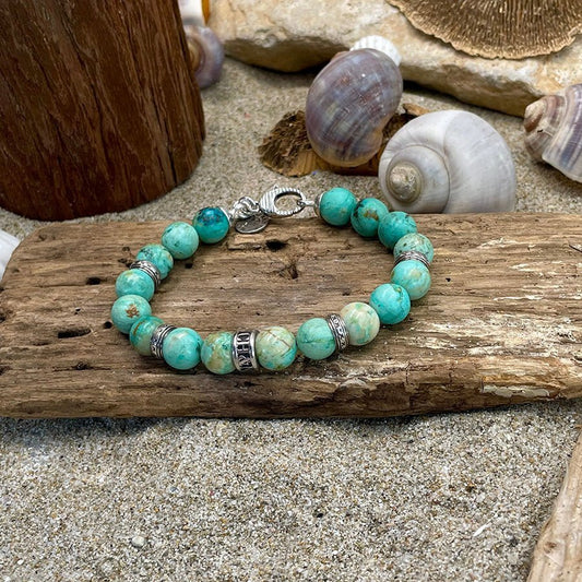 Bracelet homme AQUAHOLIC – perles de turquoise du Pérou 10 mm, donut central, fermoir mousqueton oversize strié et argent 925 – bijoux fait main en argent 925 | Pitch & Néo