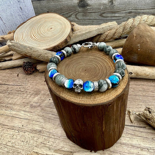 Bracelet homme SHINING SKULL – perles d’œil d’aigle 10 mm, tête de mort signature et fermoir skull argent 925 – bijoux fait main en argent 925 | Pitch & Néo